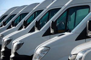 white commercial vans parked